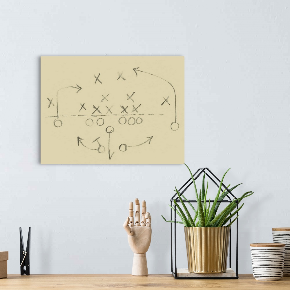 A bohemian room featuring Sketch of a football play in a diagram of X's and O's.