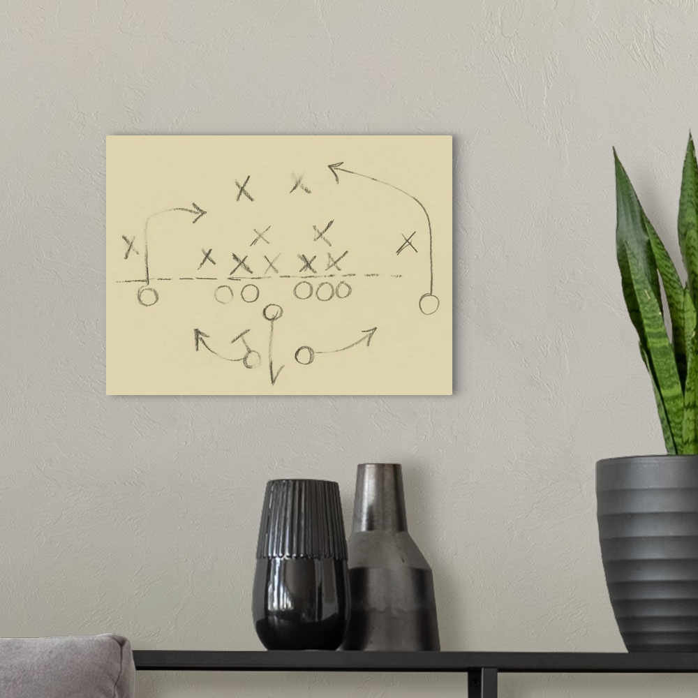 A modern room featuring Sketch of a football play in a diagram of X's and O's.