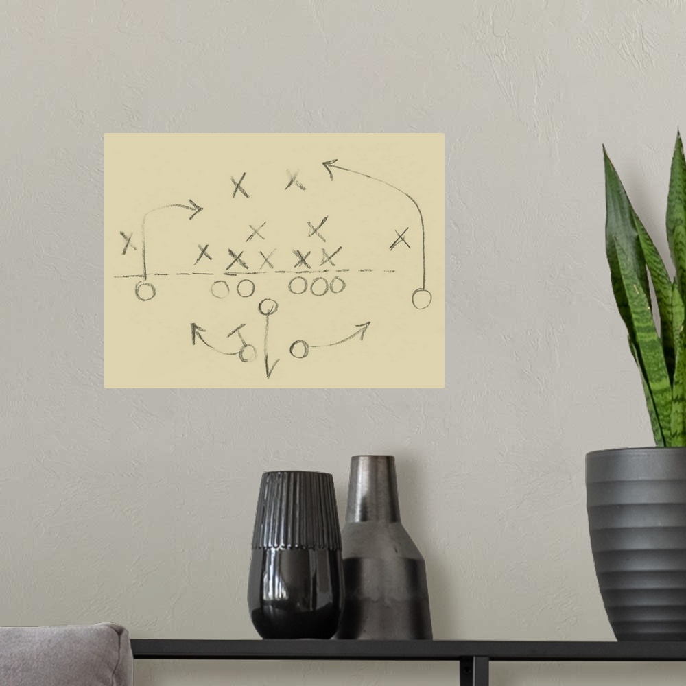 A modern room featuring Sketch of a football play in a diagram of X's and O's.
