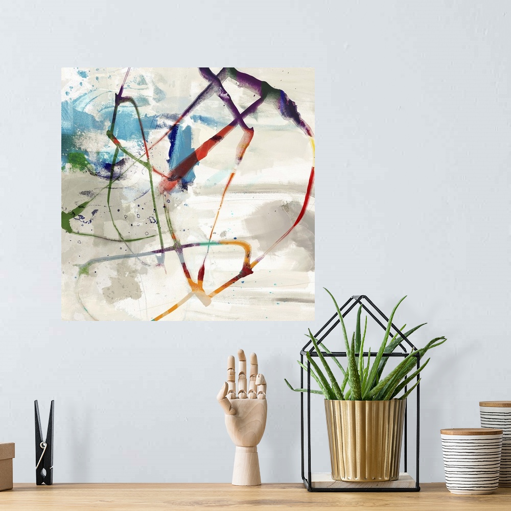 A bohemian room featuring Abstract artwork with swirling colorful brush strokes and splatters of blue paint.
