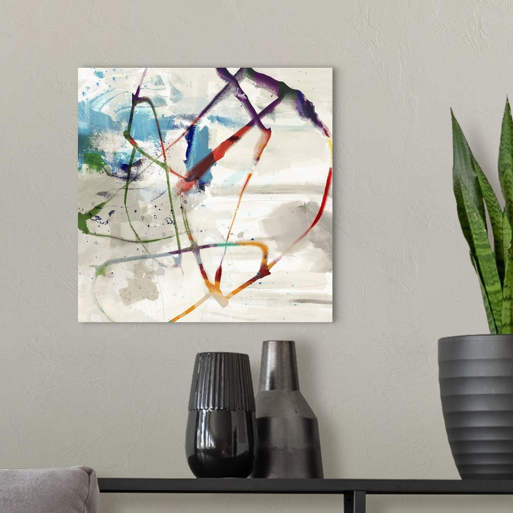 A modern room featuring Abstract artwork with swirling colorful brush strokes and splatters of blue paint.