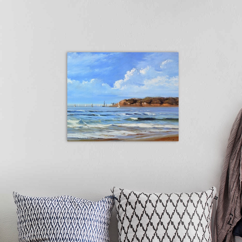 A bohemian room featuring Contemporary painting of a coastal landscape.