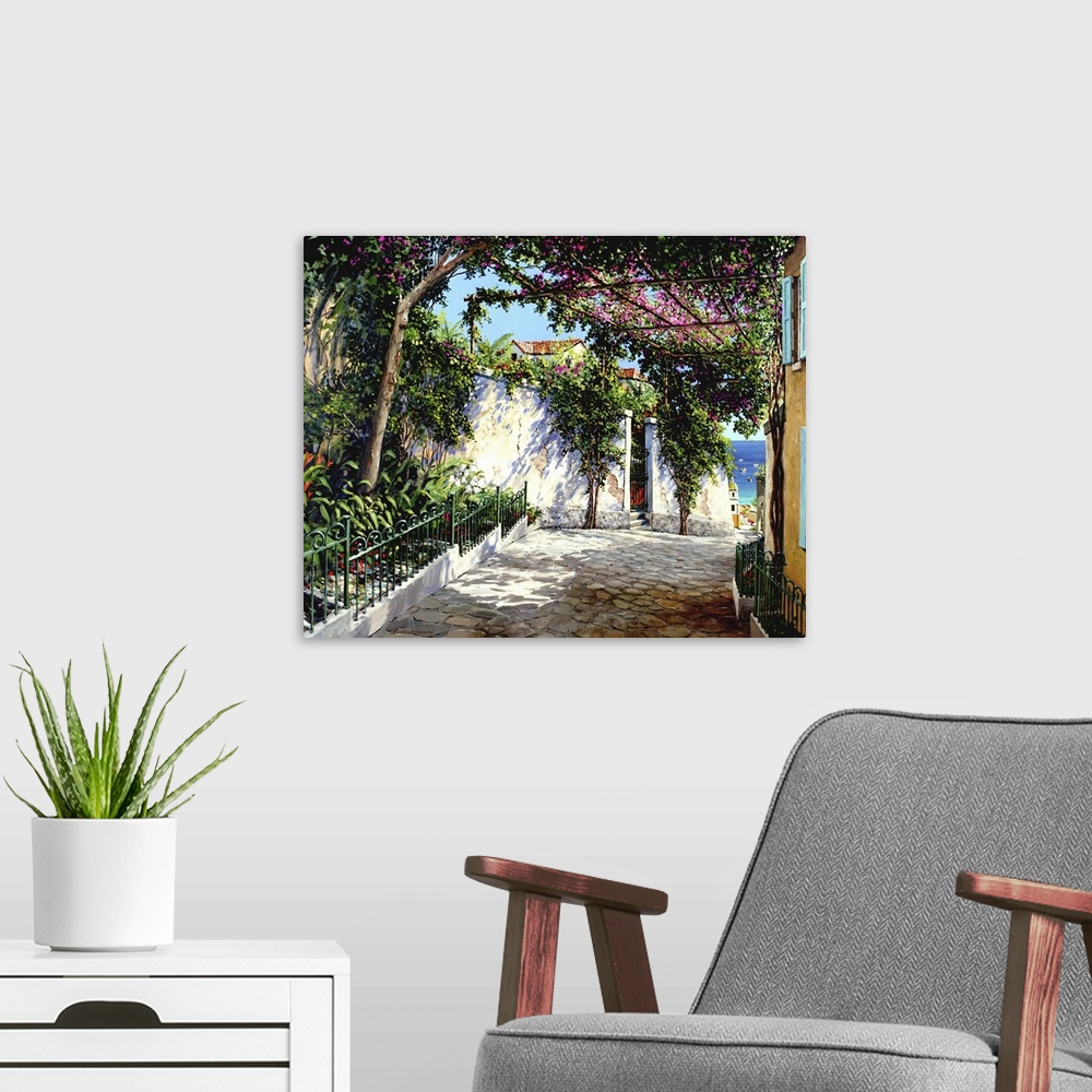 A modern room featuring Contemporary artwork of a street scene in the Italian town of Positano.