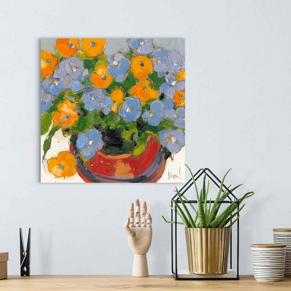 A bohemian room featuring Contemporary artwork of a pot full of blue and yellow flowers.