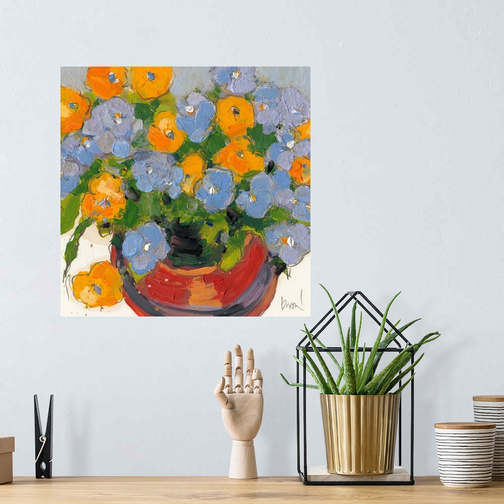 A bohemian room featuring Contemporary artwork of a pot full of blue and yellow flowers.