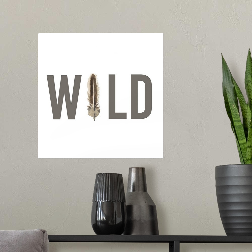 A modern room featuring WILD written in grey with a watercolored feather representing the 'I'