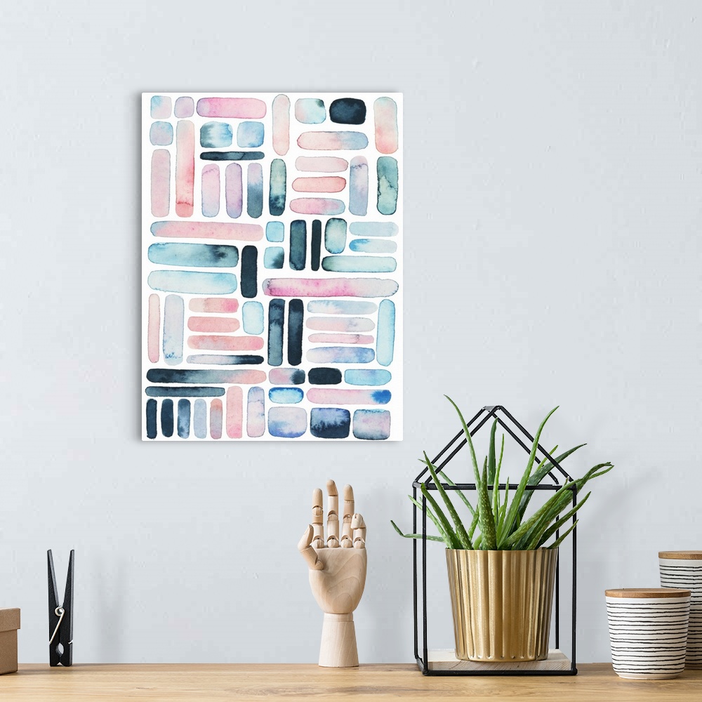A bohemian room featuring Vertical watercolor painting of varies rounded square and rectangle shapes in a grid design.