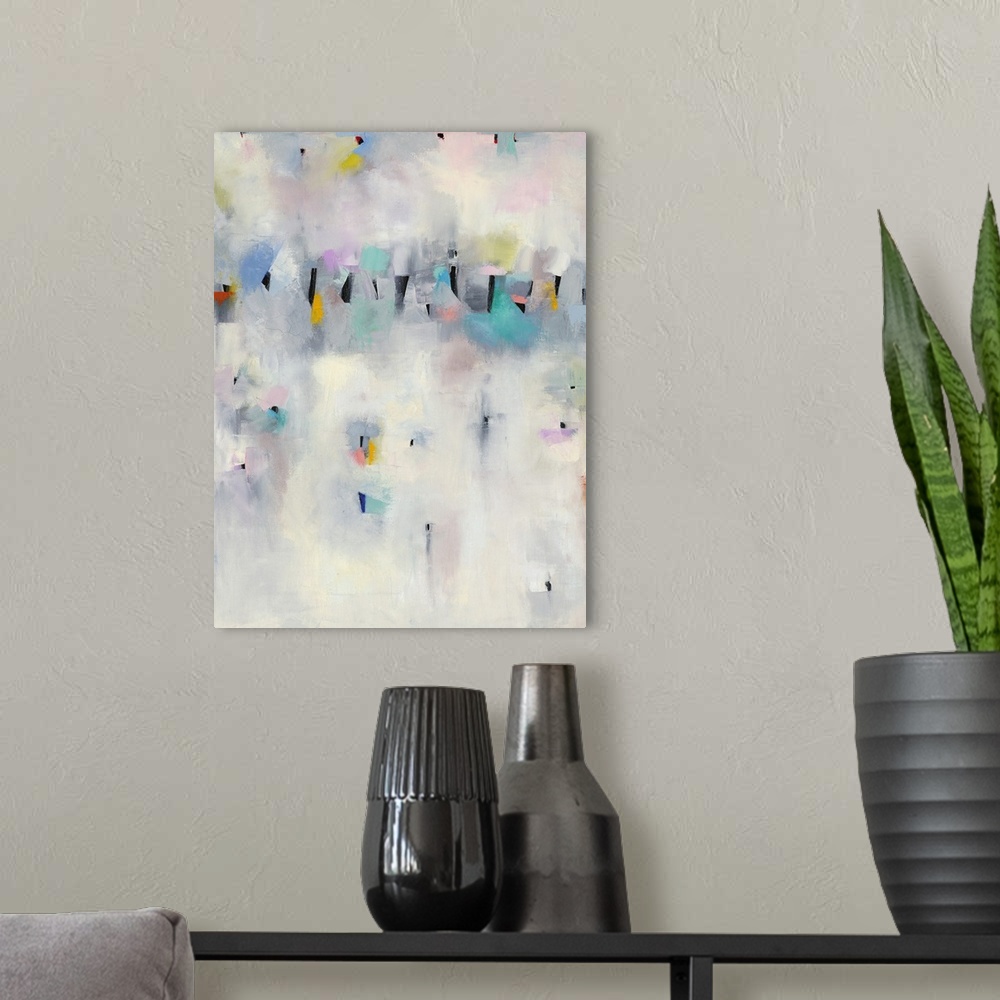 A modern room featuring Contemporary abstract painting using pale pastel splashes of color against a neutral background.