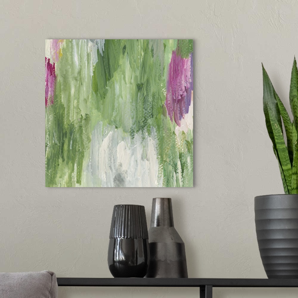 A modern room featuring Colorful contemporary abstract painting using pink and green.