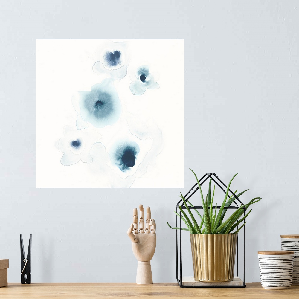 A bohemian room featuring Minimalist abstract artwork of blue watercolor spots on white.