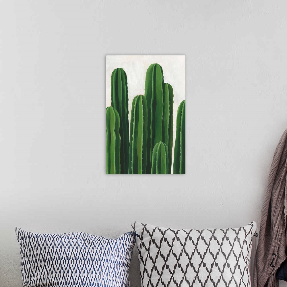 A bohemian room featuring Artwork featuring luscious cacti against a mottled background with gray and off-white brush strokes.
