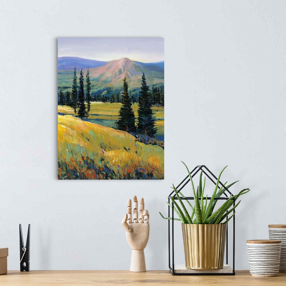A bohemian room featuring Contemporary painting of a mountain valley landscape with a small river and pine trees.