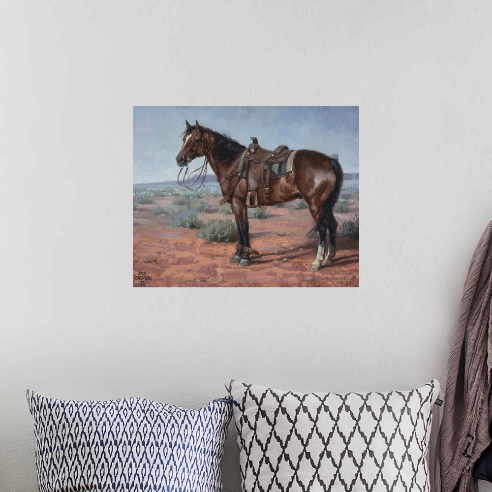 A bohemian room featuring Contemporary painting of a horse with a bridle and saddle standing in a desert landscape.