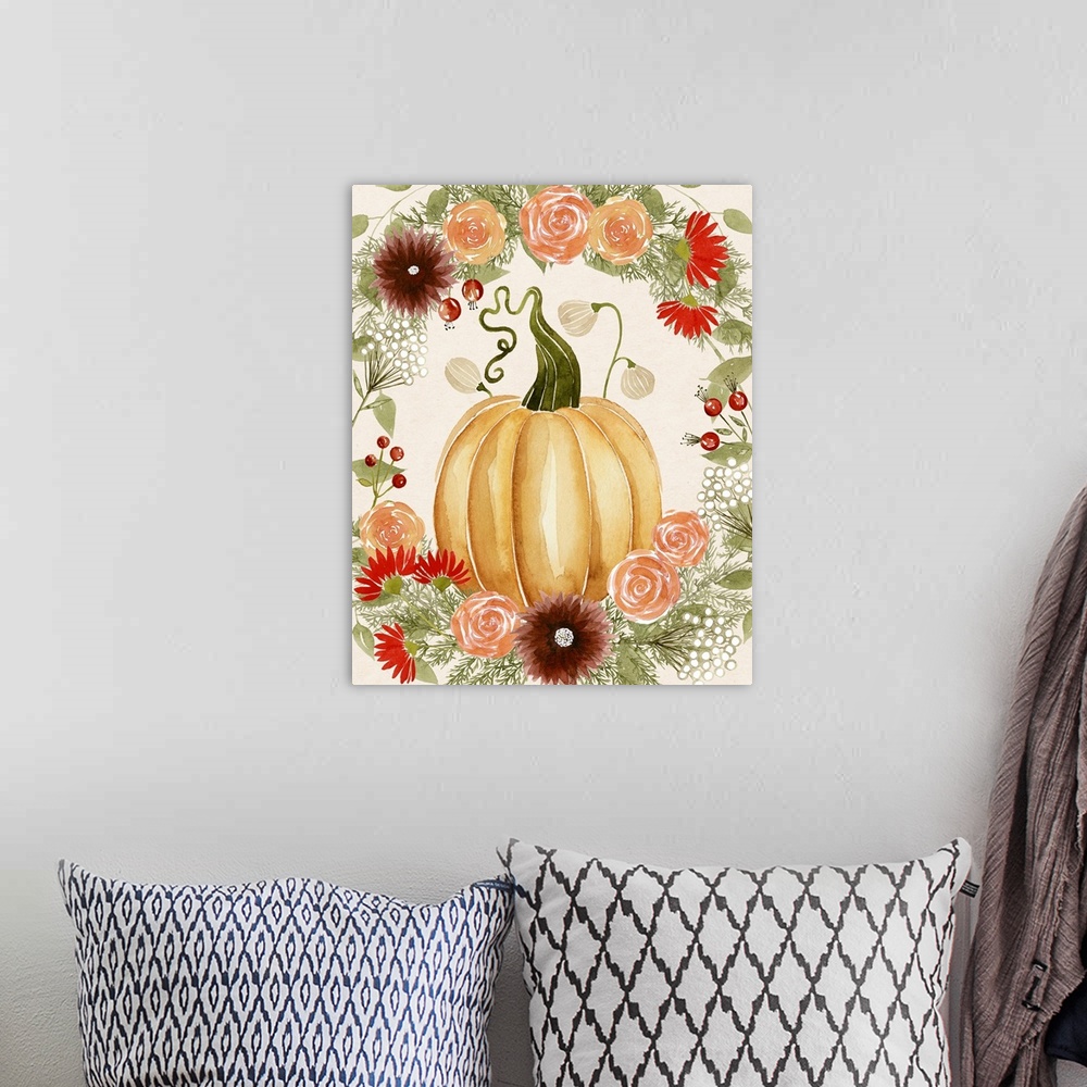 A bohemian room featuring Autumn decor with a watercolor painted pumpkin and Fall florals surrounding it.