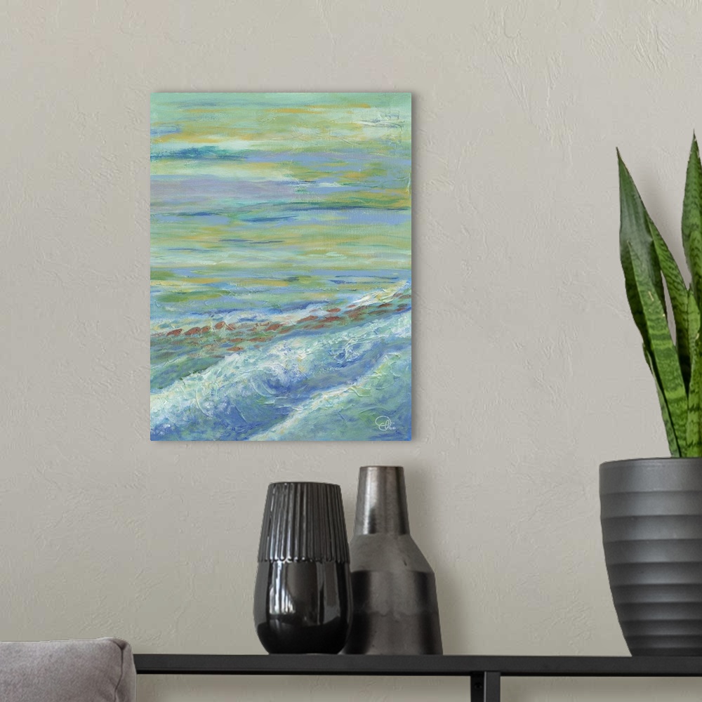 A modern room featuring Contemporary artwork of the ocean with shallow waves, under a cloudy sky.