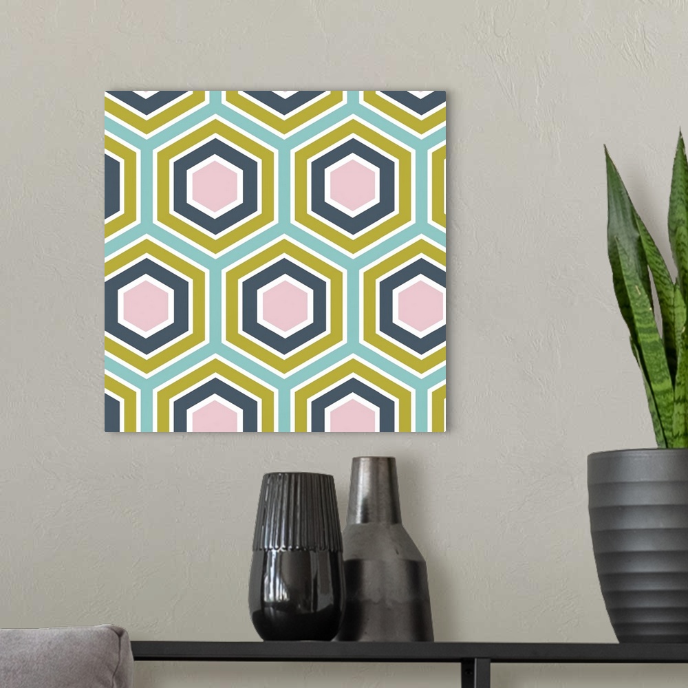 A modern room featuring Geometric artwork of hexagons in bright, summer tones.
