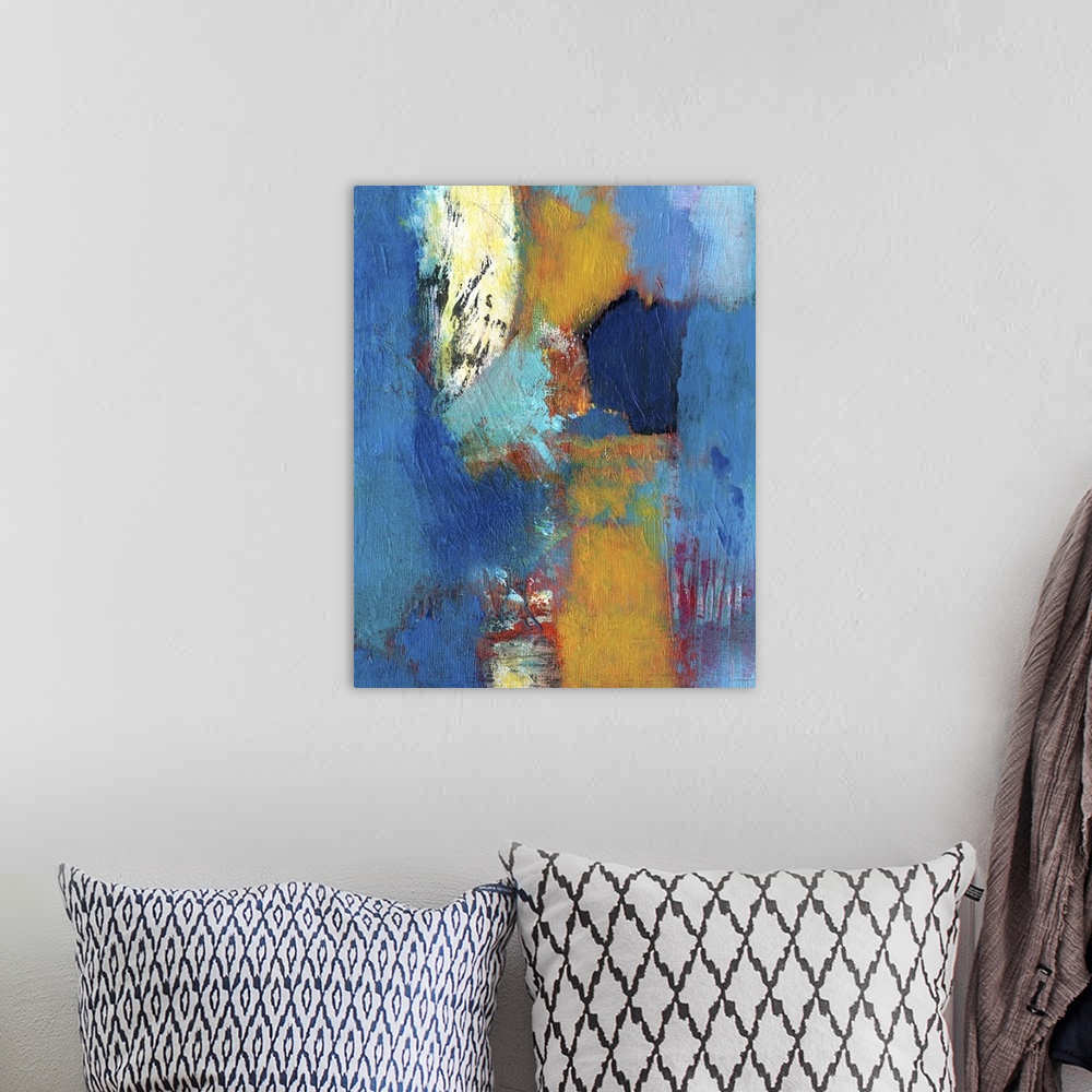 A bohemian room featuring Abstract contemporary artwork in deep blue with contrasting amber and red.