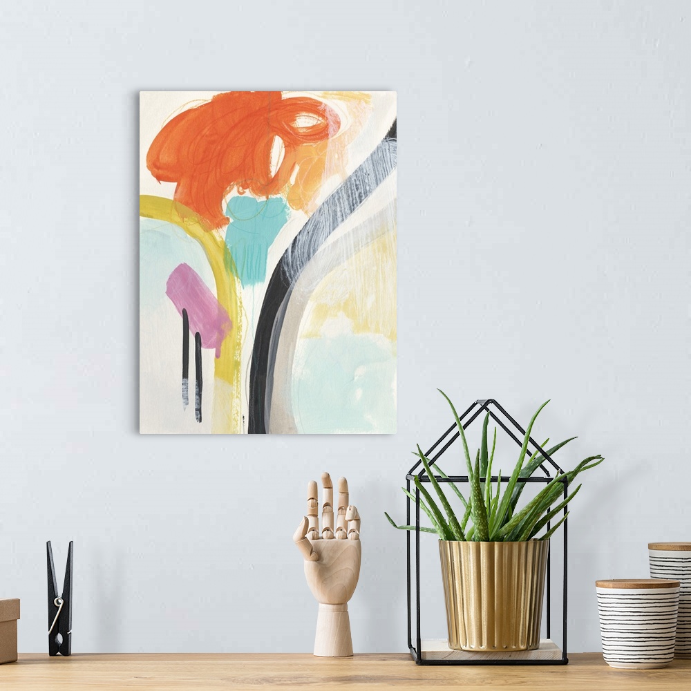 A bohemian room featuring Brightly colored abstract painting with orange, teal, and yellow.
