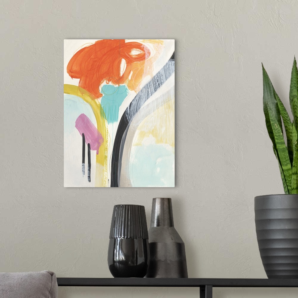 A modern room featuring Brightly colored abstract painting with orange, teal, and yellow.