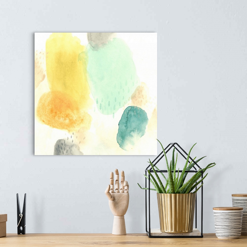 A bohemian room featuring Cheery abstract artwork in yellow and blue pastel colors.
