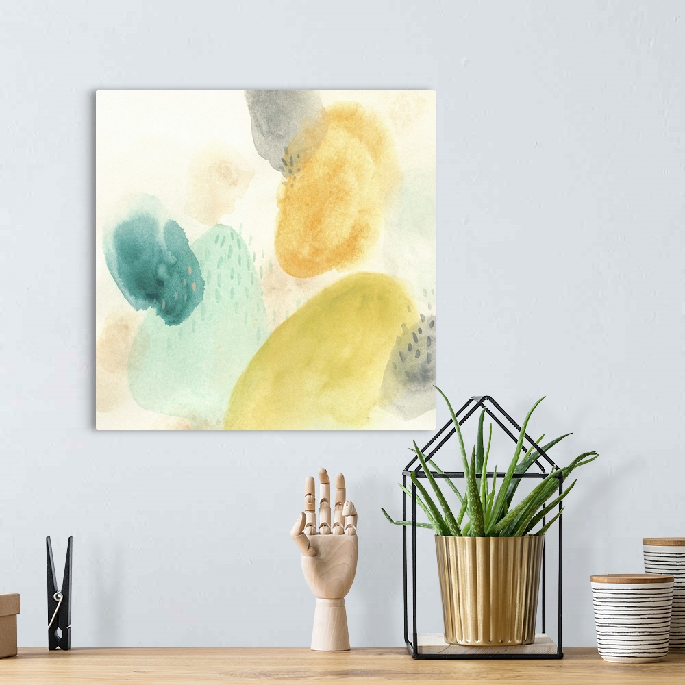 A bohemian room featuring Cheery abstract artwork in yellow and blue pastel colors.