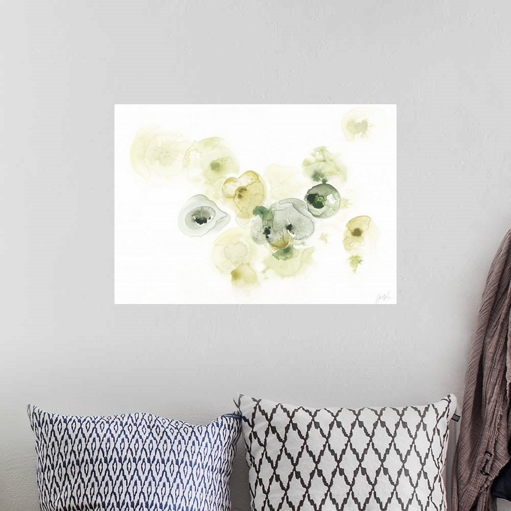 A bohemian room featuring This decorative art features green and yellow watercolor droplets to form lichen like shapes on a...
