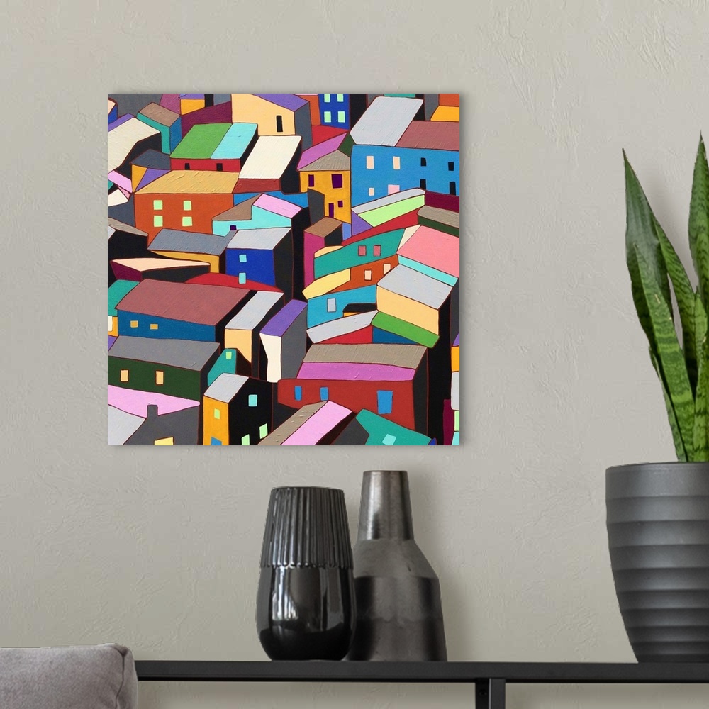 A modern room featuring Contemporary painting of colorful houses seen from above.
