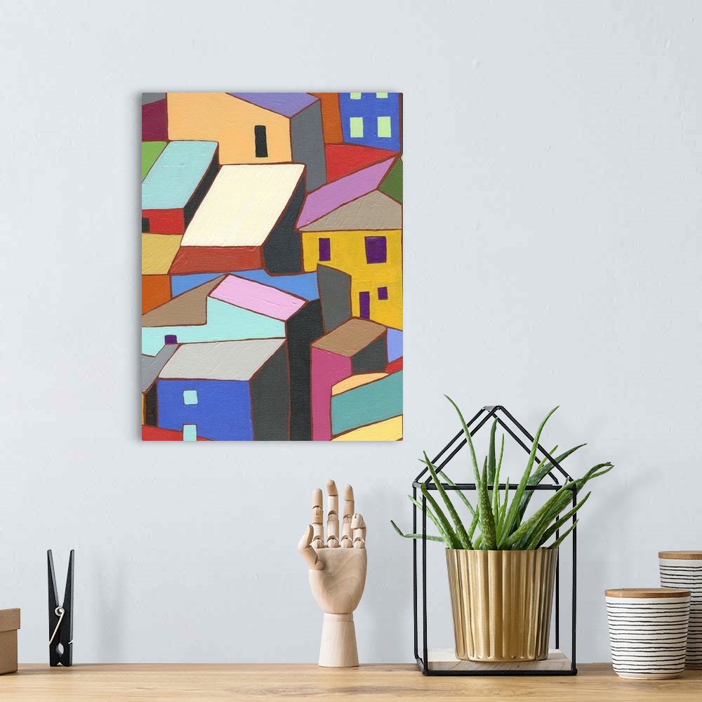 A bohemian room featuring Painting of colorful buildings and rooftops.