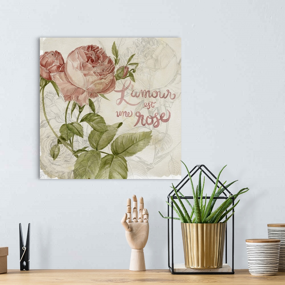 A bohemian room featuring Decorative artwork of illustrated colored roses over rose line art with the words, "L'amour est u...