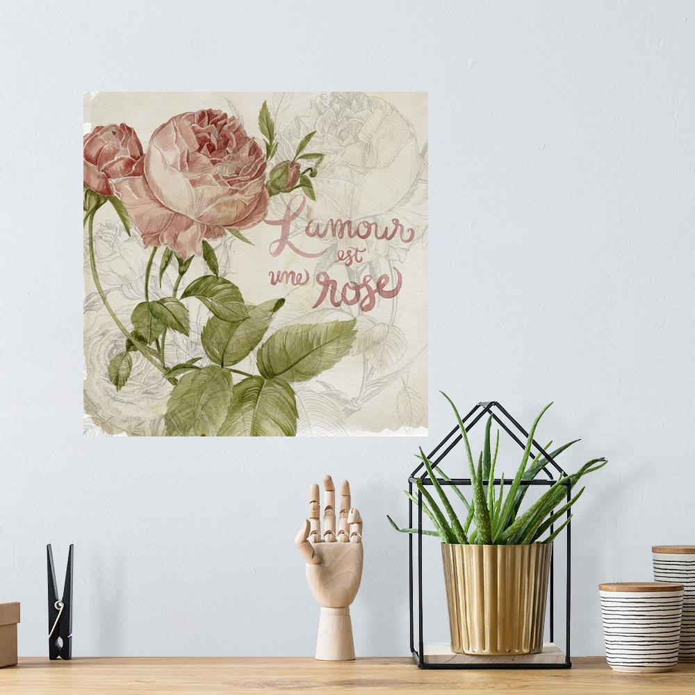 A bohemian room featuring Decorative artwork of illustrated colored roses over rose line art with the words, "L'amour est u...