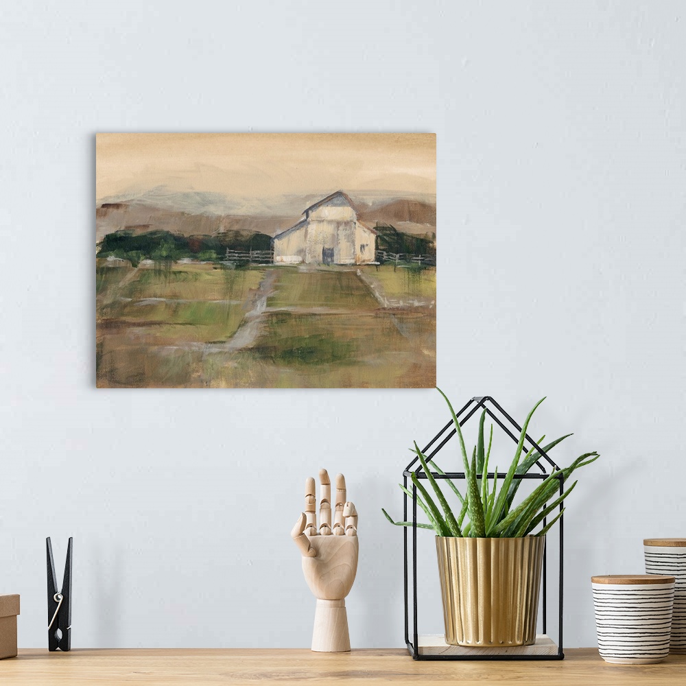 A bohemian room featuring Contemporary artwork of farmland and a white barn in low afternoon light.