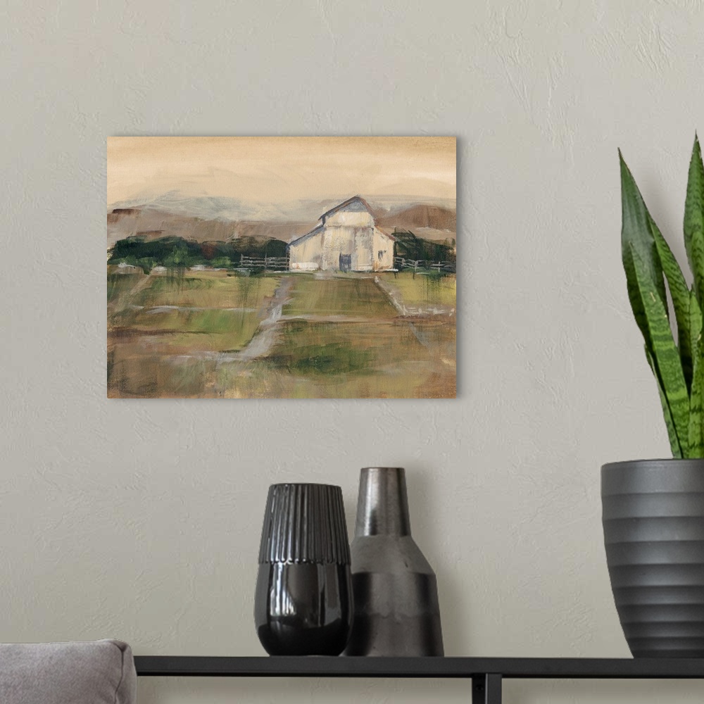 A modern room featuring Contemporary artwork of farmland and a white barn in low afternoon light.