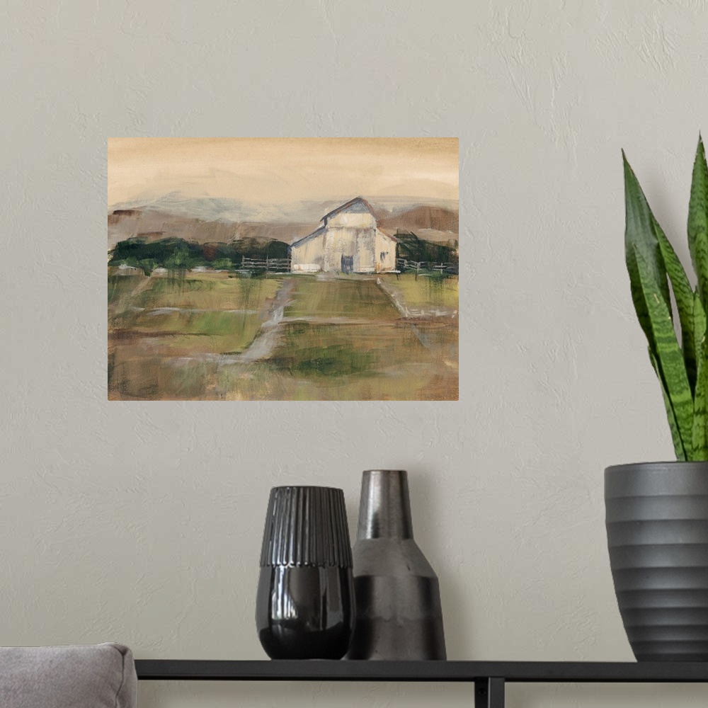 A modern room featuring Contemporary artwork of farmland and a white barn in low afternoon light.