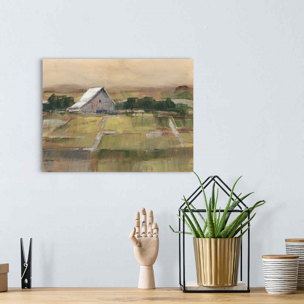 A bohemian room featuring Contemporary artwork of farmland and a white barn in low afternoon light.