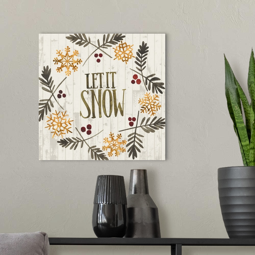 A modern room featuring Folk art style Christmas wreath encircling the words "Let It Snow" with holly berries and golden ...