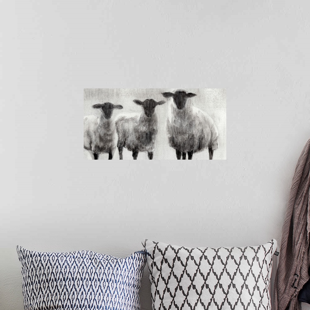 A bohemian room featuring Monochrome painting of three woolly sheep in a field.