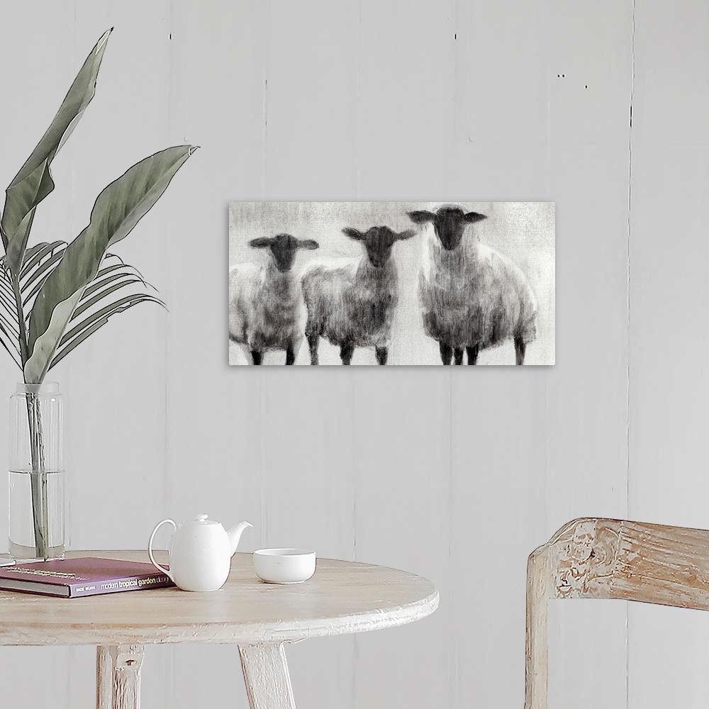 A farmhouse room featuring Monochrome painting of three woolly sheep in a field.