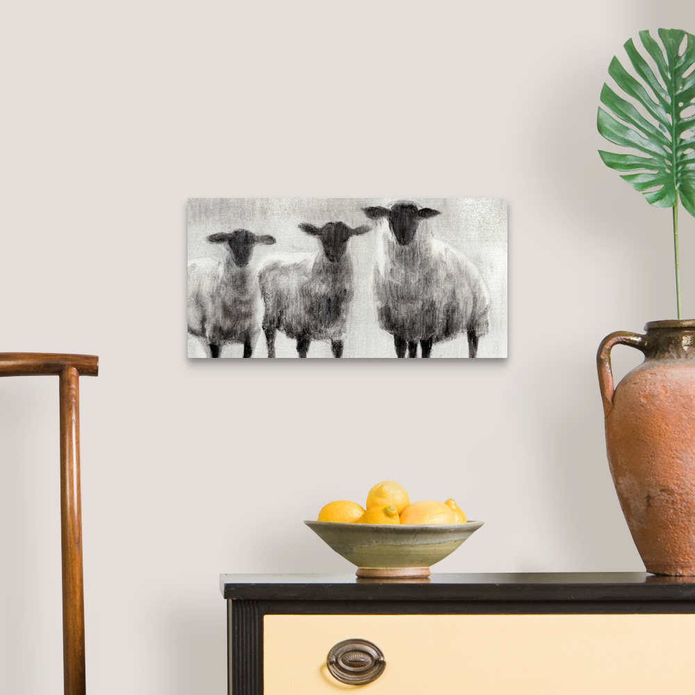 A traditional room featuring Monochrome painting of three woolly sheep in a field.
