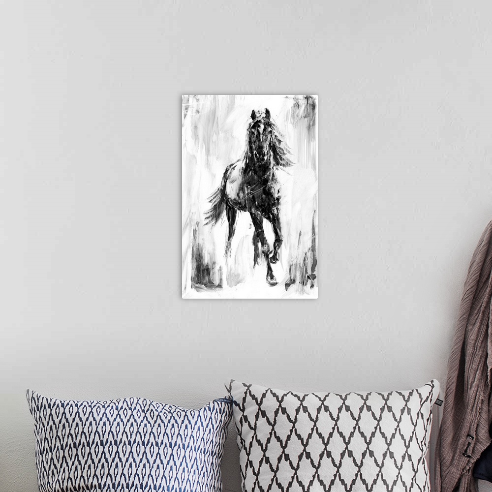 A bohemian room featuring Black and white artwork of a galloping dark horse.