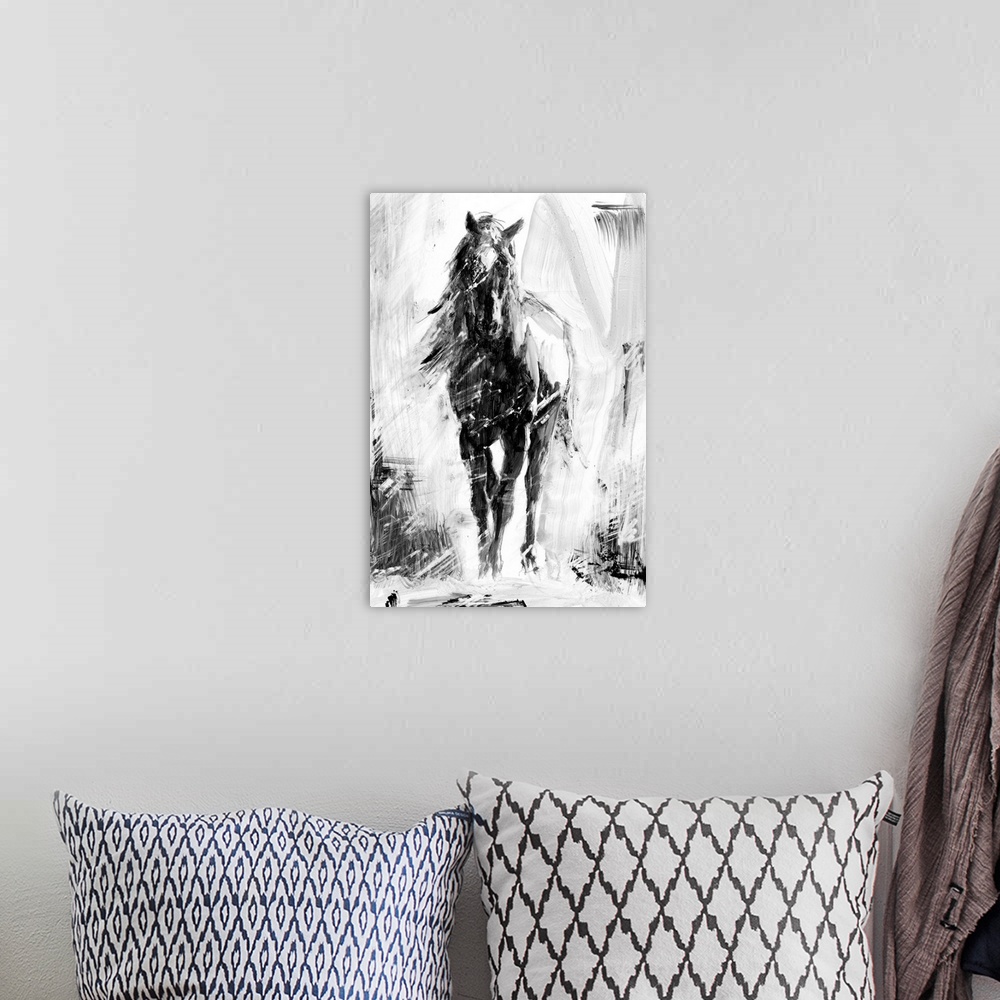 A bohemian room featuring Black and white artwork of a galloping dark horse.