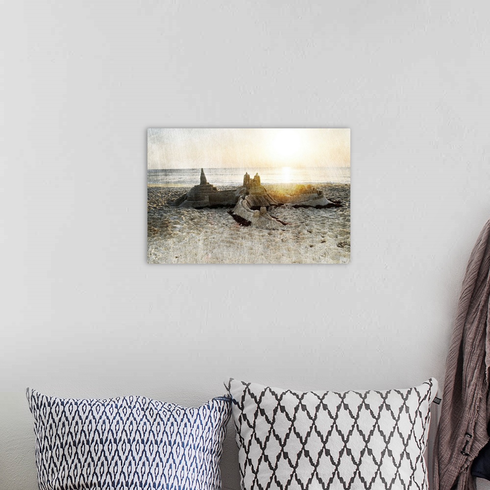 A bohemian room featuring Photograph of a sand castle on a beach with a rough textured overlay.