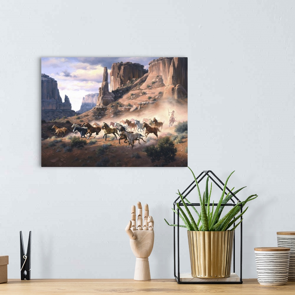 A bohemian room featuring Contemporary Western artwork of a stampeding herd of horses kicking up dust in a rocky desert can...