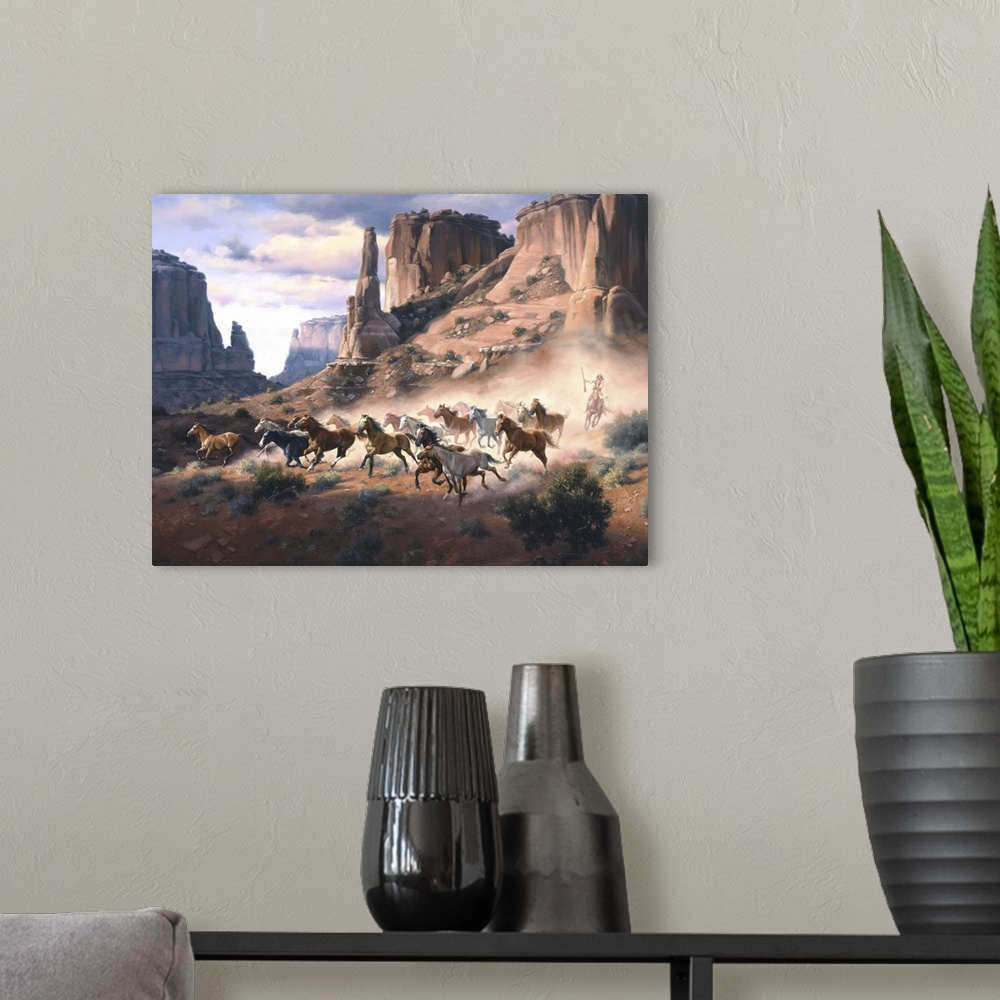 A modern room featuring Contemporary Western artwork of a stampeding herd of horses kicking up dust in a rocky desert can...