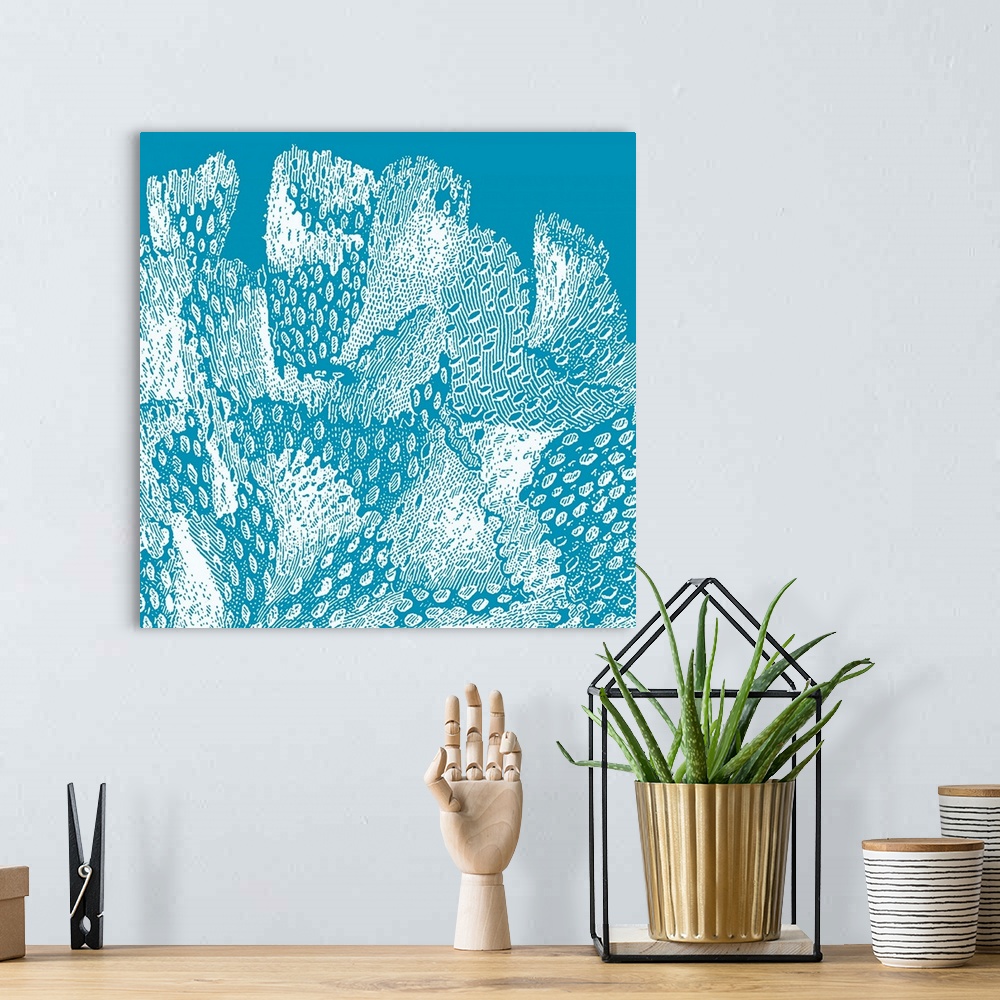 A bohemian room featuring Square wall art featuring outlines of coral in white on a bright aqua background