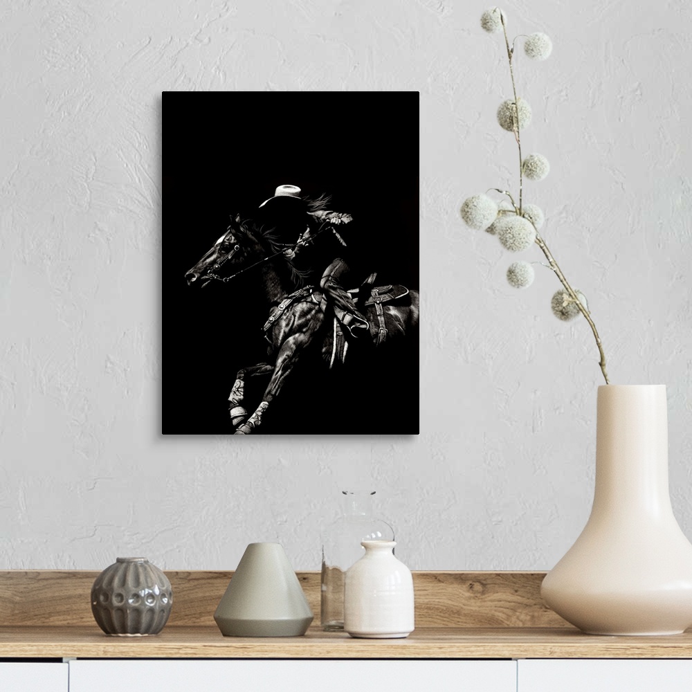 A farmhouse room featuring Black and white lifelike illustration of a cowboy riding a horse.
