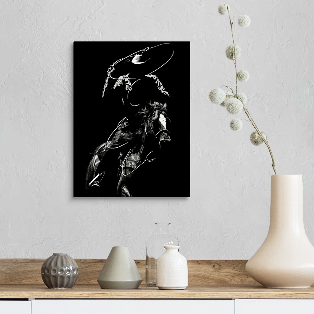 A farmhouse room featuring Black and white lifelike illustration of a cowboy riding a horse with a lasso.