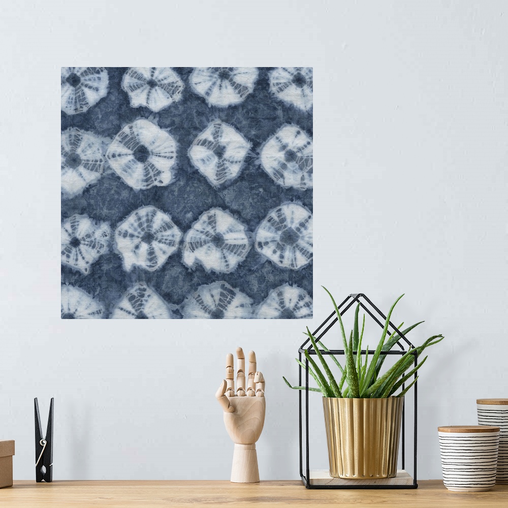 A bohemian room featuring Artistic design of rows of a tie-dye pattern in white on a blue background.