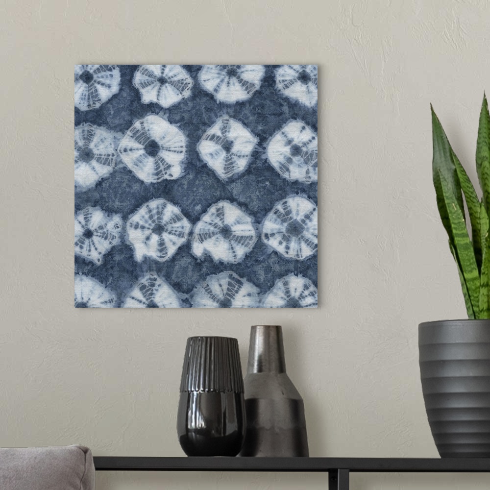 A modern room featuring Artistic design of rows of a tie-dye pattern in white on a blue background.