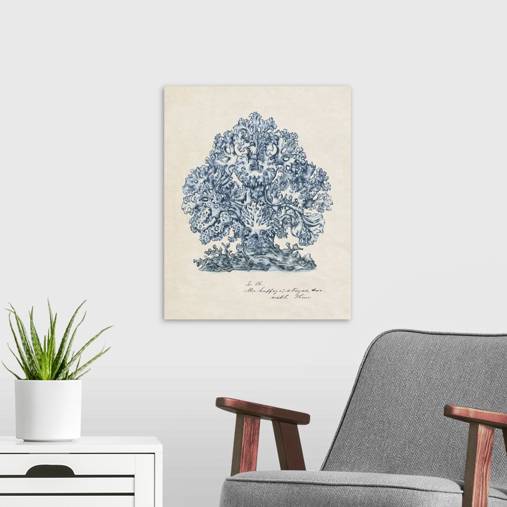 A modern room featuring A watercolor illustration of details of coral in blue against a beige backdrop.
