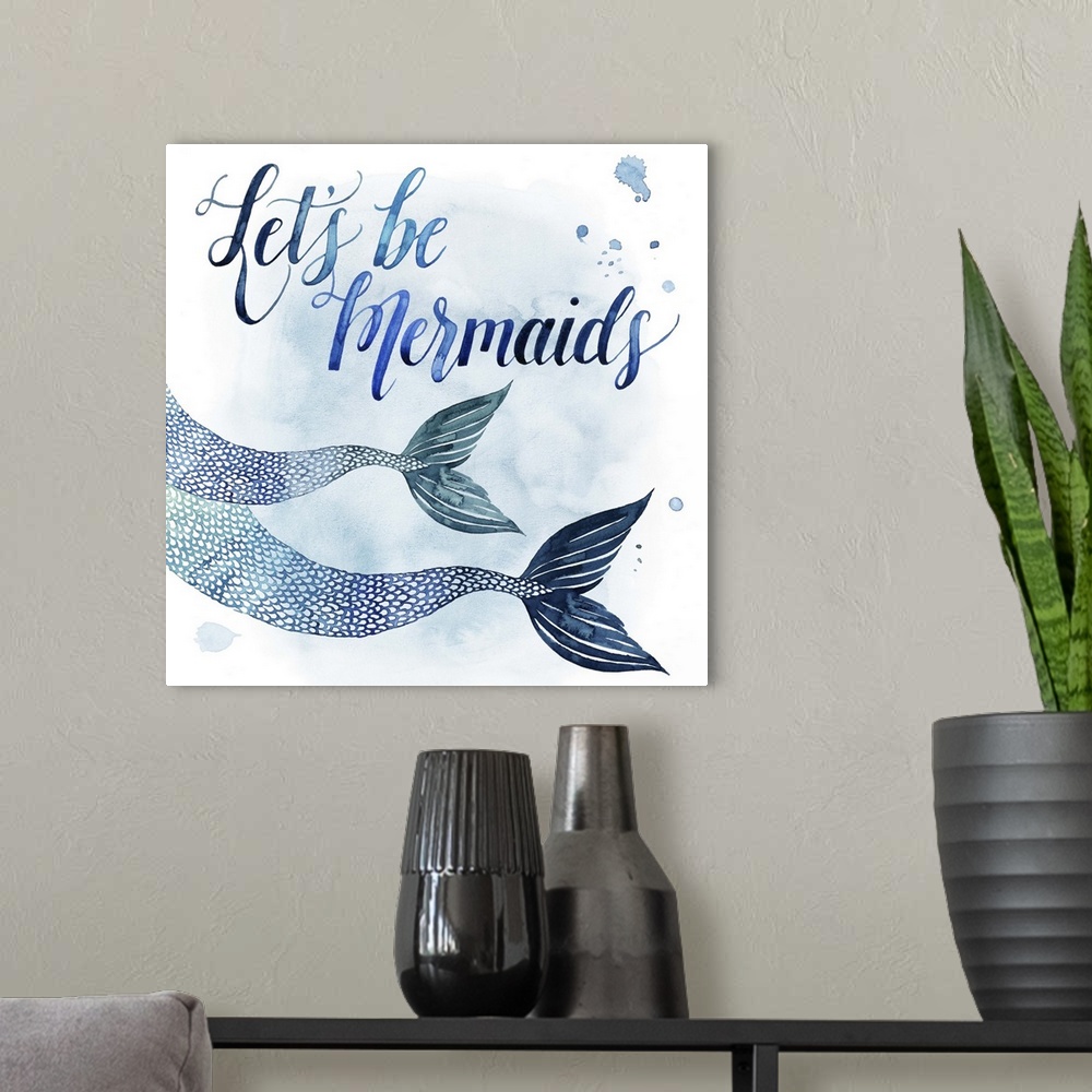 A modern room featuring Square beach themed decor with painted mermaid fins and the phrase "Let's Be Mermaids" all in sha...